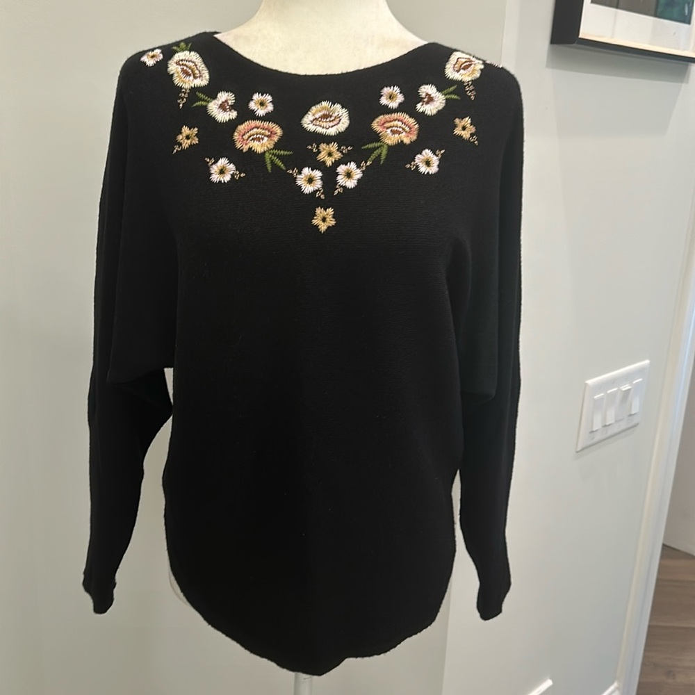 Aaeda embroidered floral front and long sleeves pullover black sweater.